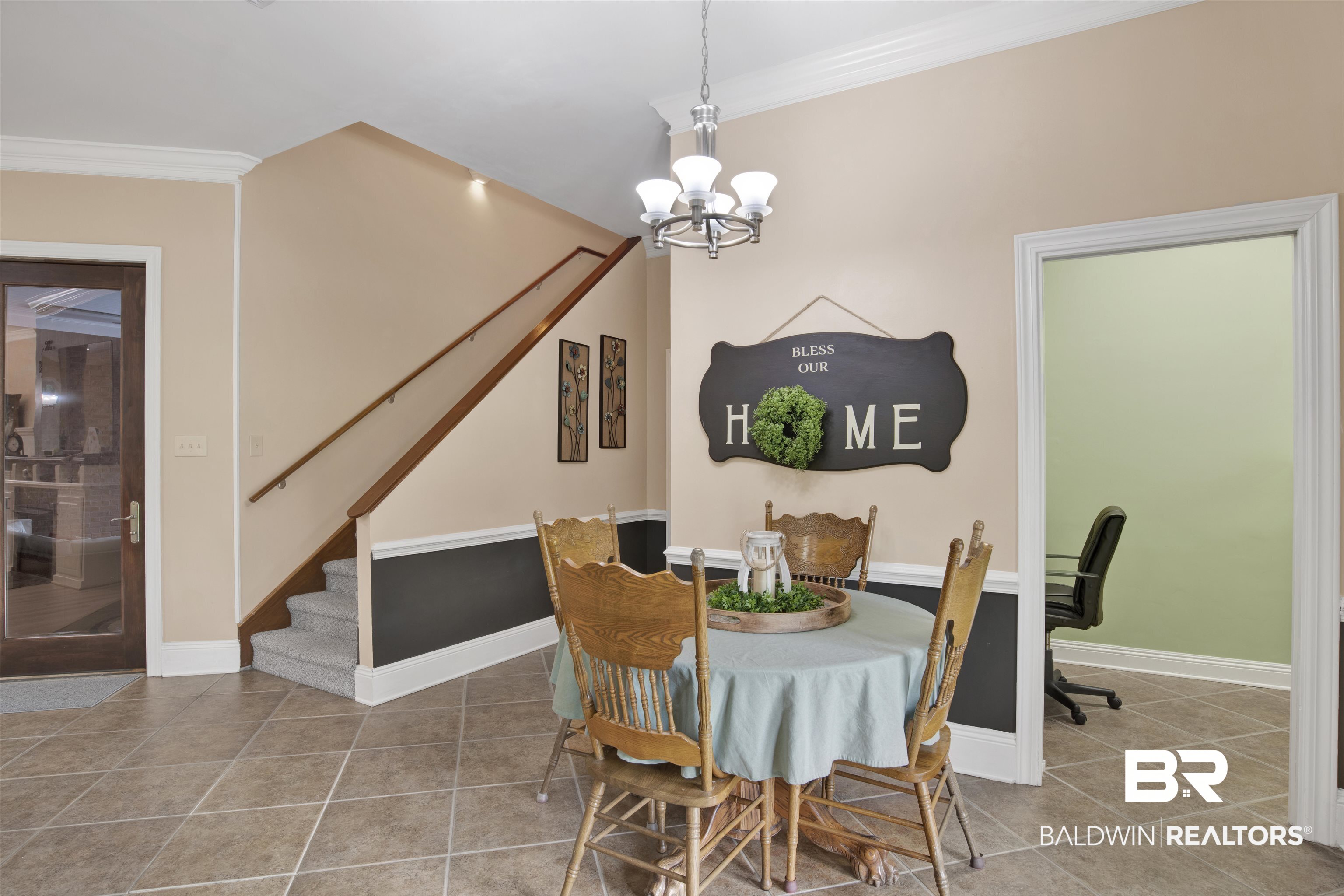 4340 Hamilton Oaks Lane Mobile, AL 36695 - Photo 16 of 51 Dining area with a notable chandelier, crown molding, and tile floors