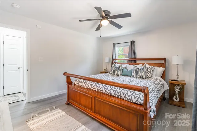 a bedroom with a bed and window