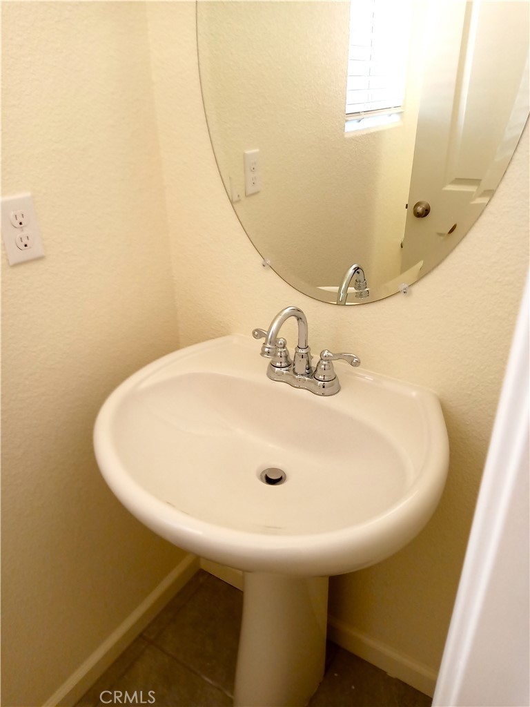 4244 Rutherford Avenue Merced, CA 95348 - Photo 3 of 23 a bathroom with a sink and mirror