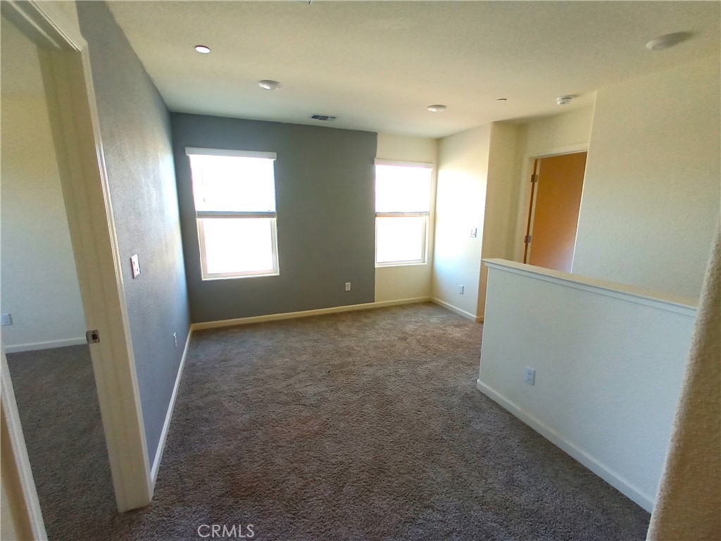 4244 Rutherford Avenue Merced, CA 95348 - Photo 9 of 23 an empty room with windows