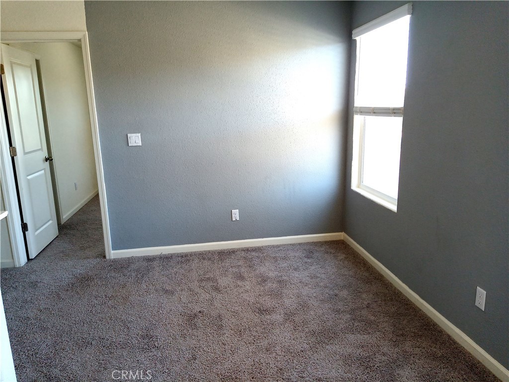 4244 Rutherford Avenue Merced, CA 95348 - Photo 10 of 23 an empty room with windows
