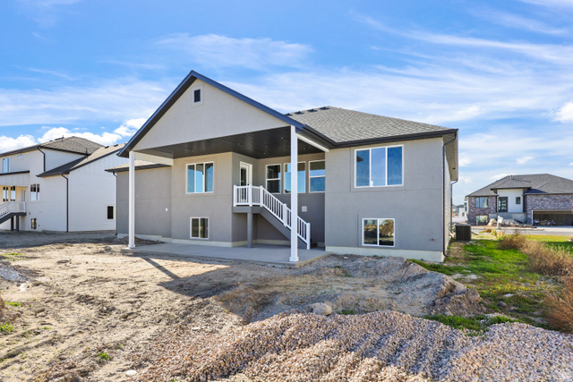 1139 South 4475 West West Point, UT 84015 - Photo 30 of 33 Rear view of house featuring a patio, stucco siding, a shingled roof, and stairs