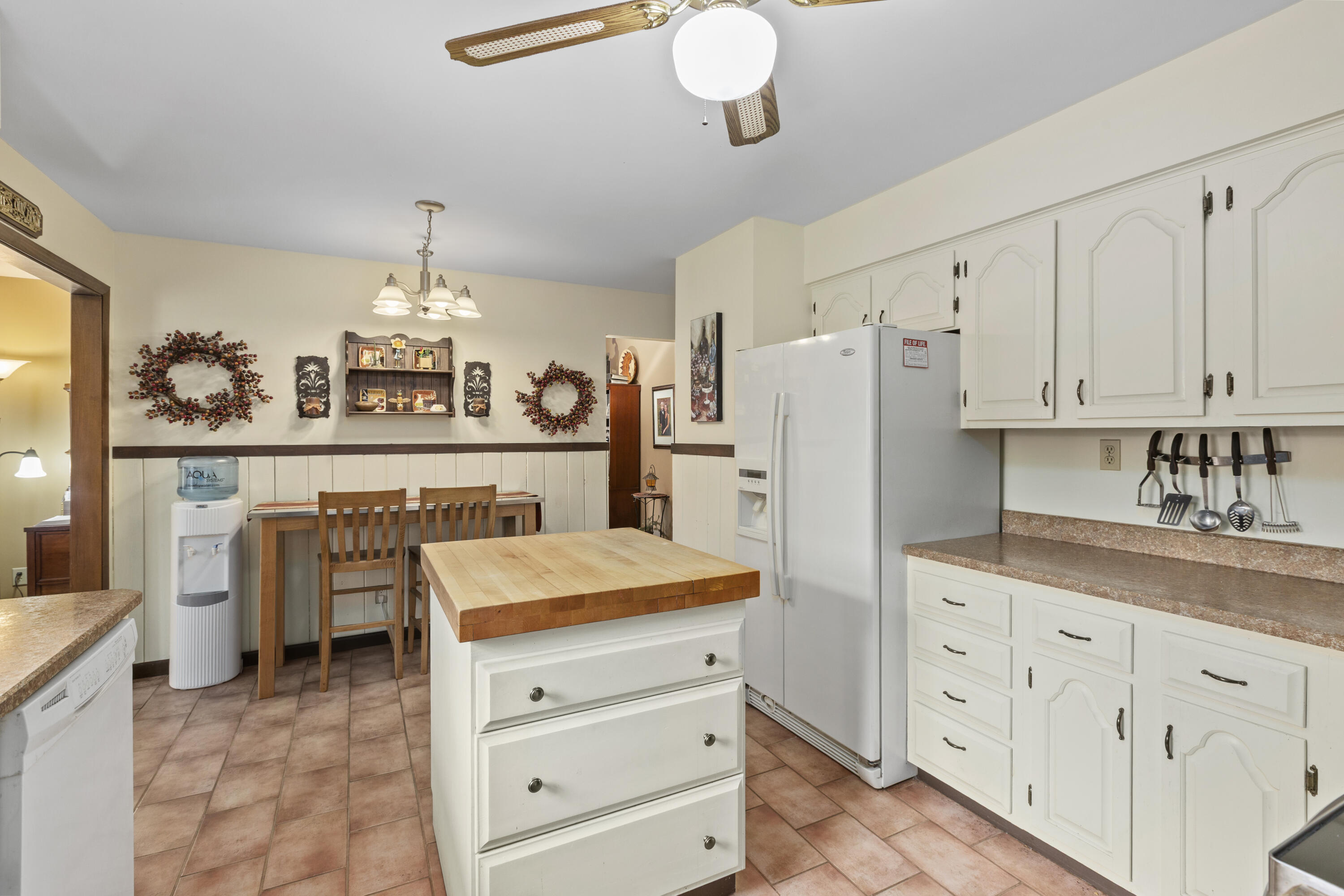 328 East Tratebas Road Valparaiso, IN 46383 - Photo 11 of 48 a kitchen with white cabinets and stainless steel appliances