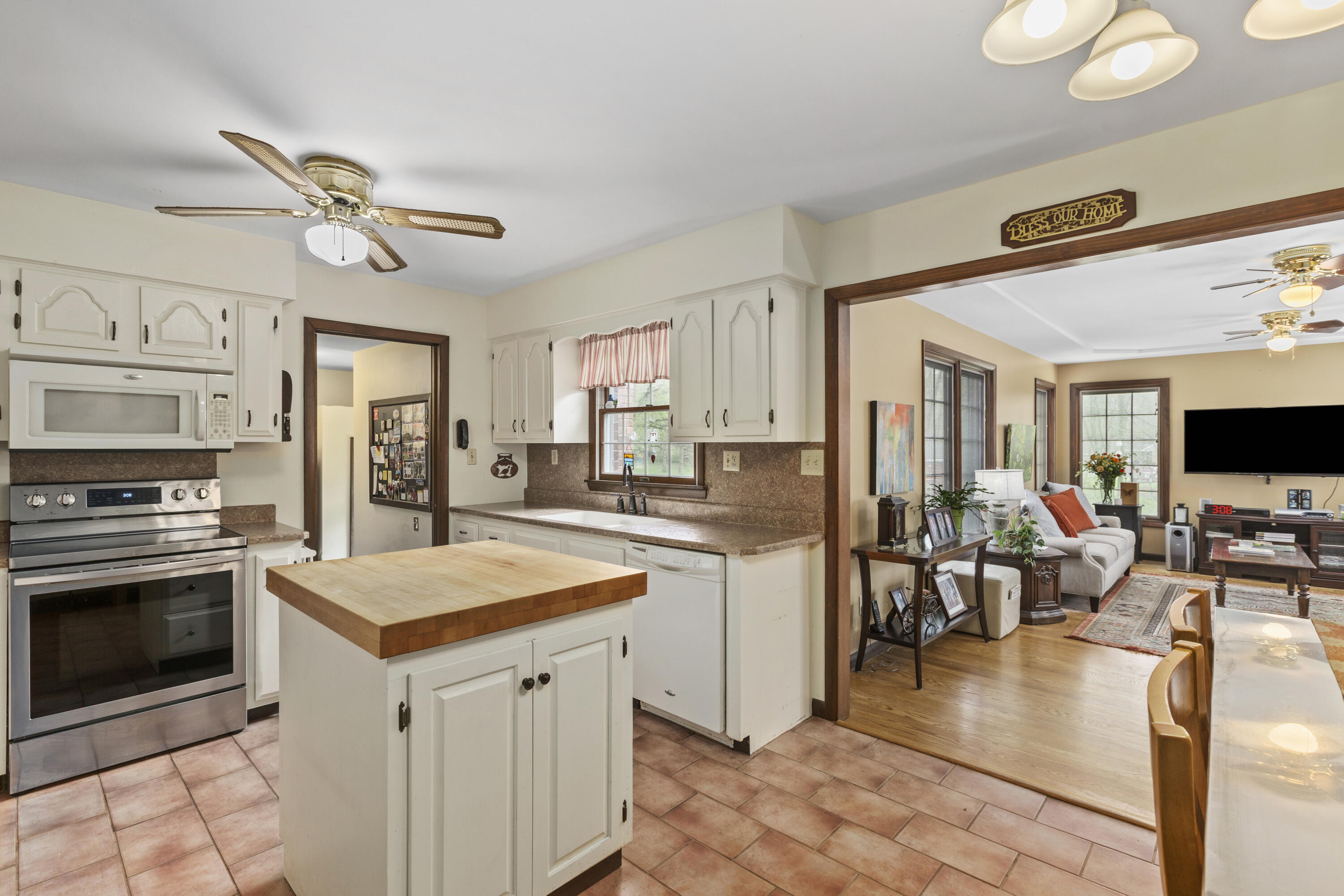 328 East Tratebas Road Valparaiso, IN 46383 - Photo 12 of 48 a open kitchen with stainless steel appliances granite countertop a stove refrigerator and a sink