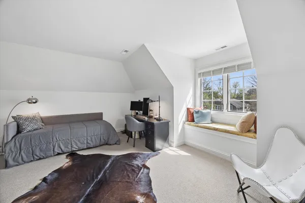 a en suite spacious bathroom with a granite countertop tub sink and mirror