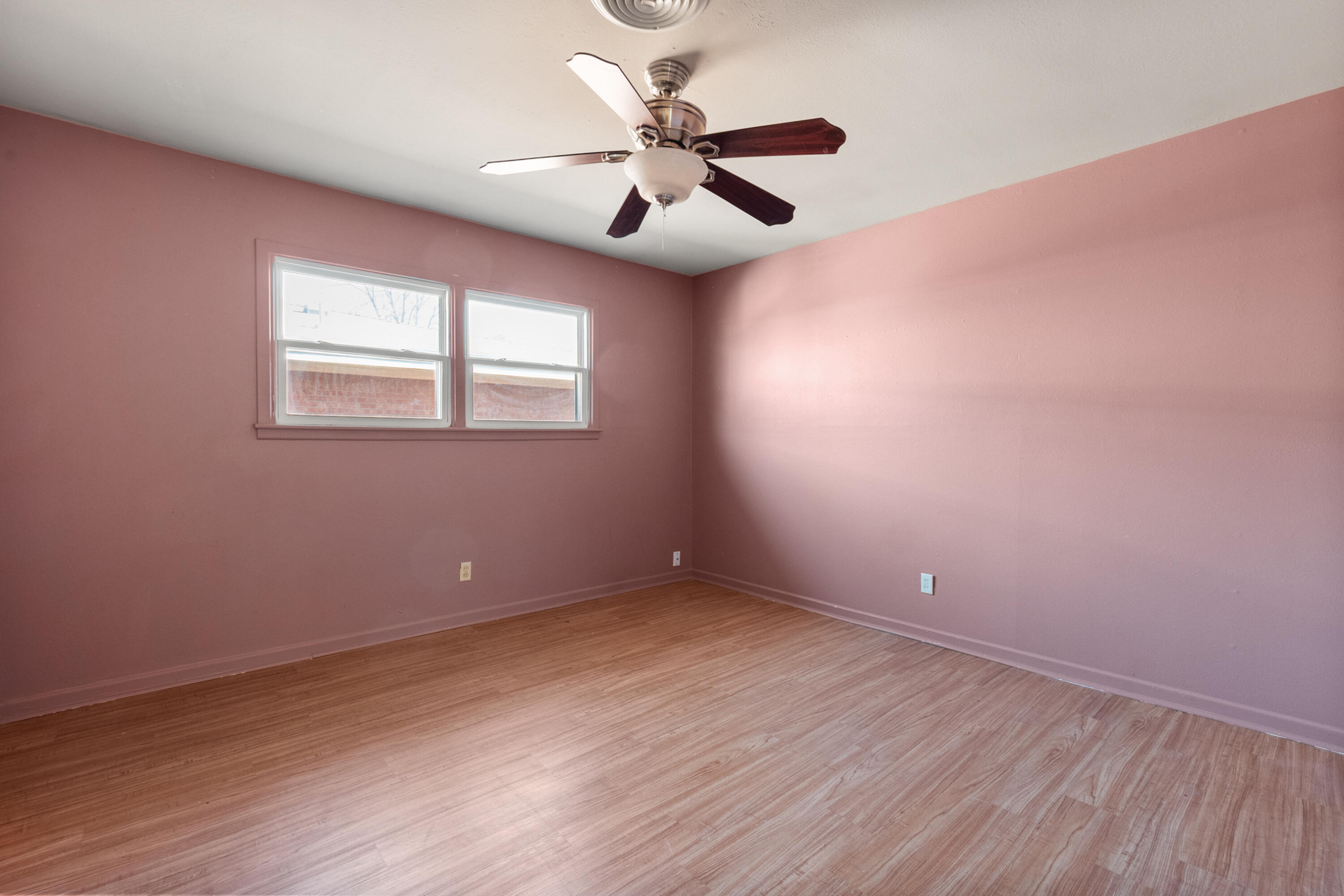 2509 61st Street Lubbock, TX 79413 - Photo 13 of 21 wooden floor in an empty room with a window