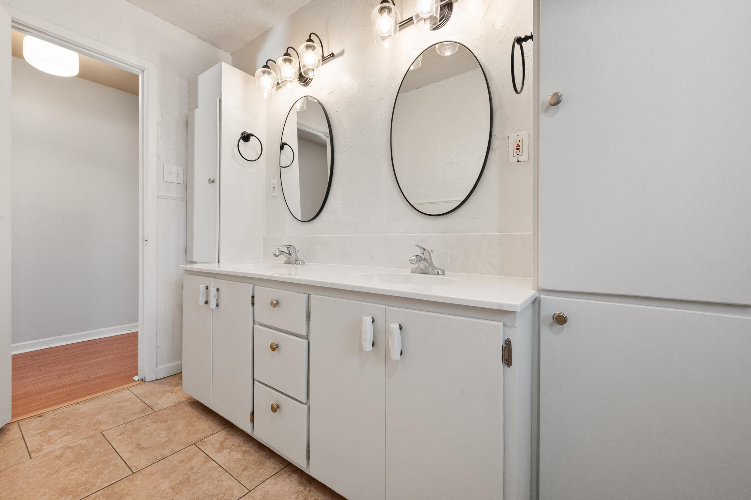 2509 61st Street Lubbock, TX 79413 - Photo 16 of 21 a bathroom with a double vanity sink and a mirror