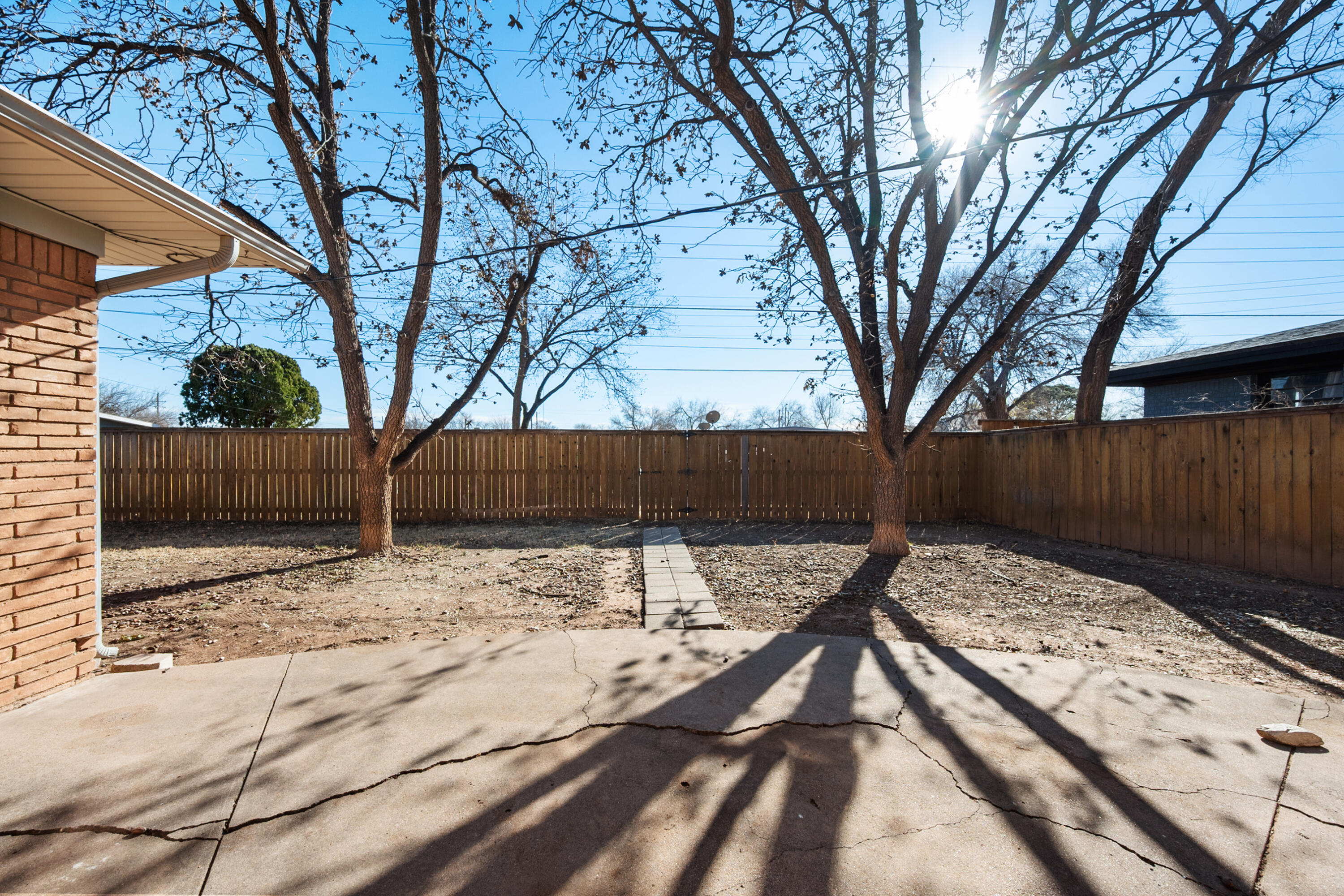 2509 61st Street Lubbock, TX 79413 - Photo 18 of 21 a view of backyard and tree