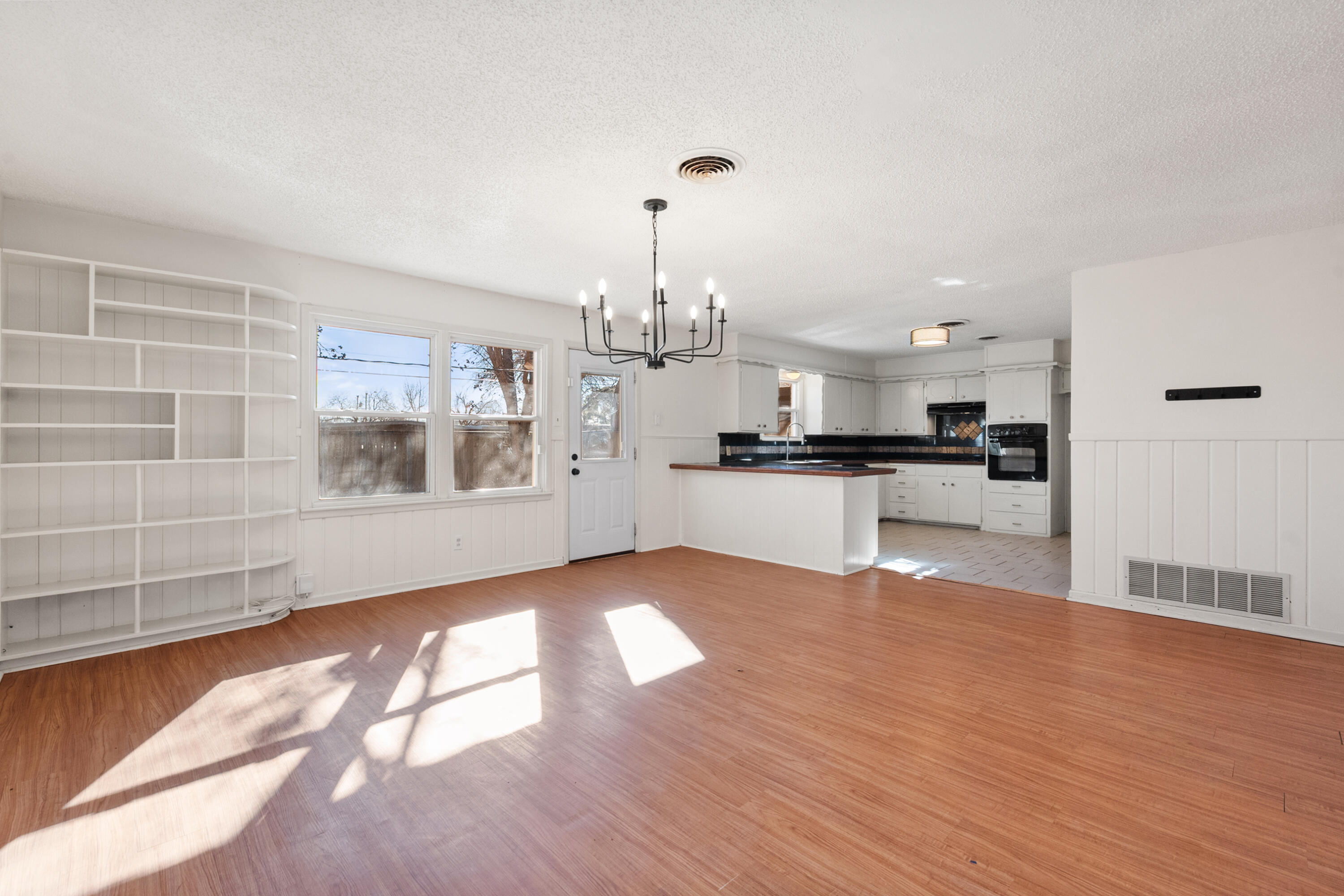 2509 61st Street Lubbock, TX 79413 - Photo 4 of 21 a view of kitchen with granite countertop cabinets and refrigerator