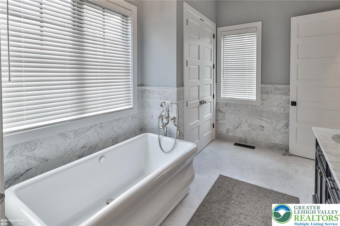 4850 West Hopewell Road Center Valley, PA 18034 - Photo 63 of 96 a bathroom with a bathtub and a window
