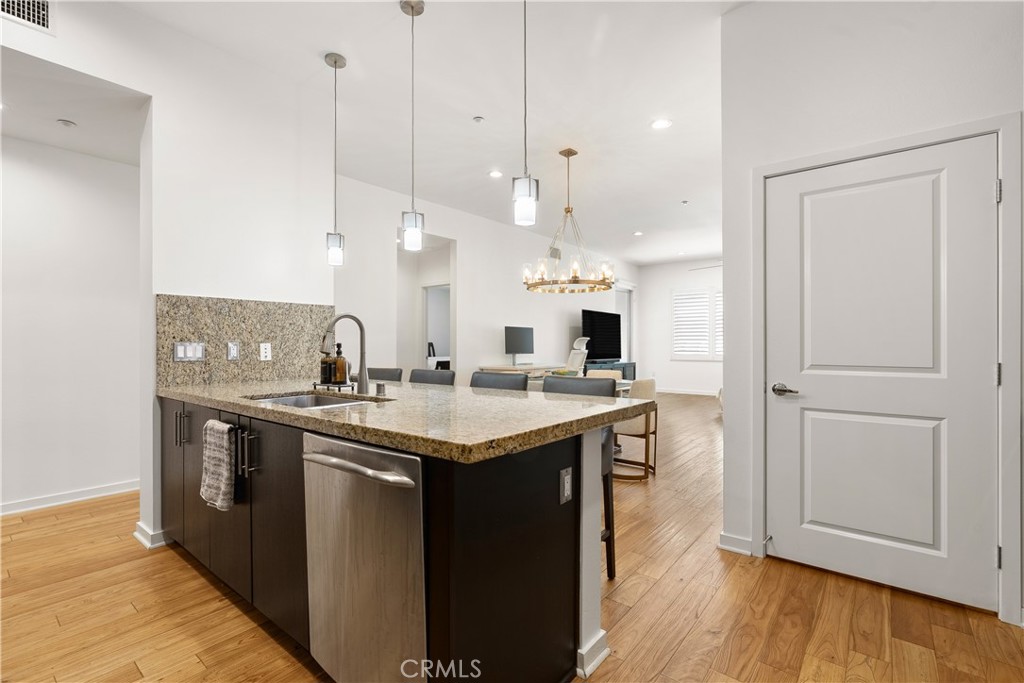 21 Gramercy, Unit 102 Irvine, CA 92612 - Photo 9 of 30 Spacious kitchen island perfect for casual dining, entertaining guests, or gathering with family.