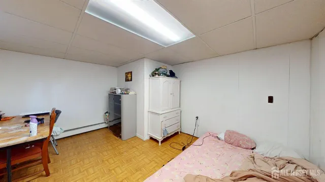 a bedroom with a bed and cabinets