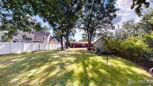 a swimming pool with outdoor seating and yard