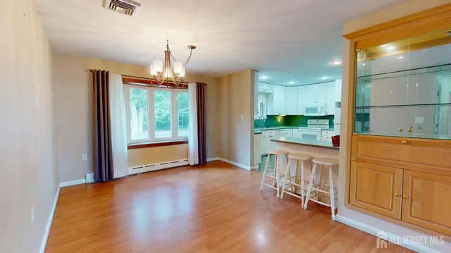 a kitchen that has a lot of cabinets in it