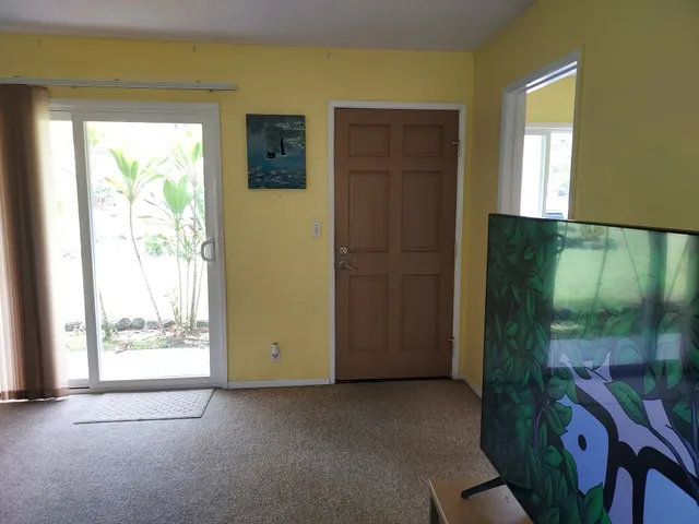 a view of a room with a large window