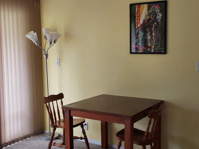 a view of a dining room with furniture