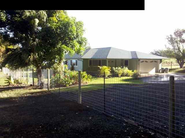a view of a house with a street