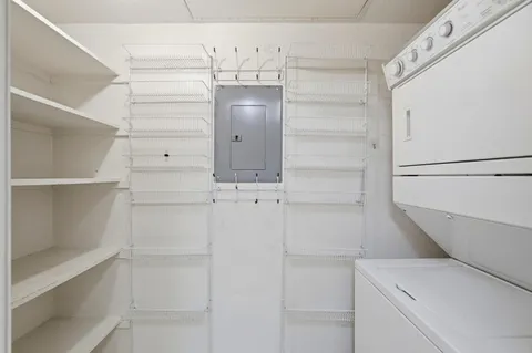 a view of walk in closet with empty racks