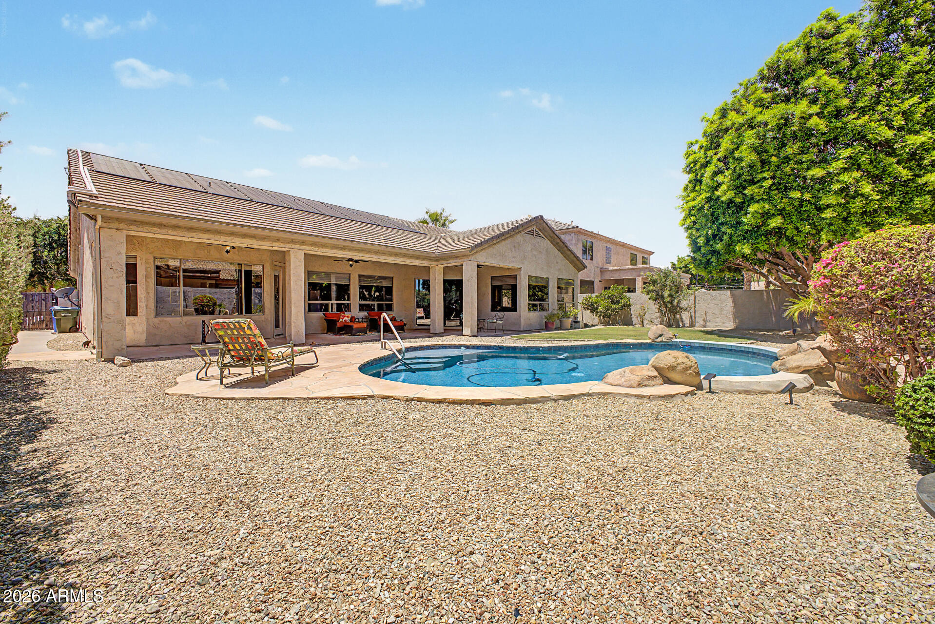 1632 West Frye Road Phoenix, AZ 85045 - Photo 29 of 37 a view of a house with a backyard and a patio