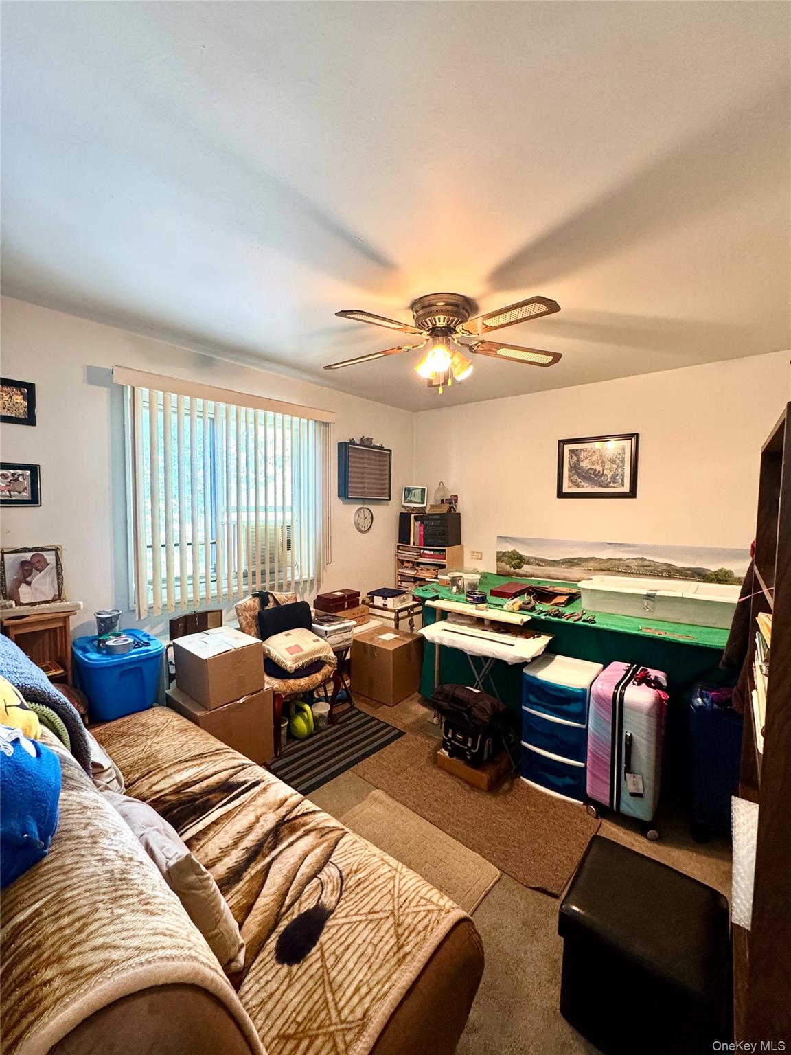 224-20 Manor Road, Unit 91 Queens, NY 11427 - Photo 11 of 17 a living room with lots of furniture and window