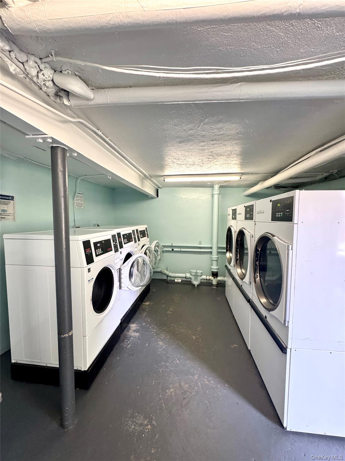 224-20 Manor Road, Unit 91 Queens, NY 11427 - Photo 16 of 17 a utility room with dryer and washer