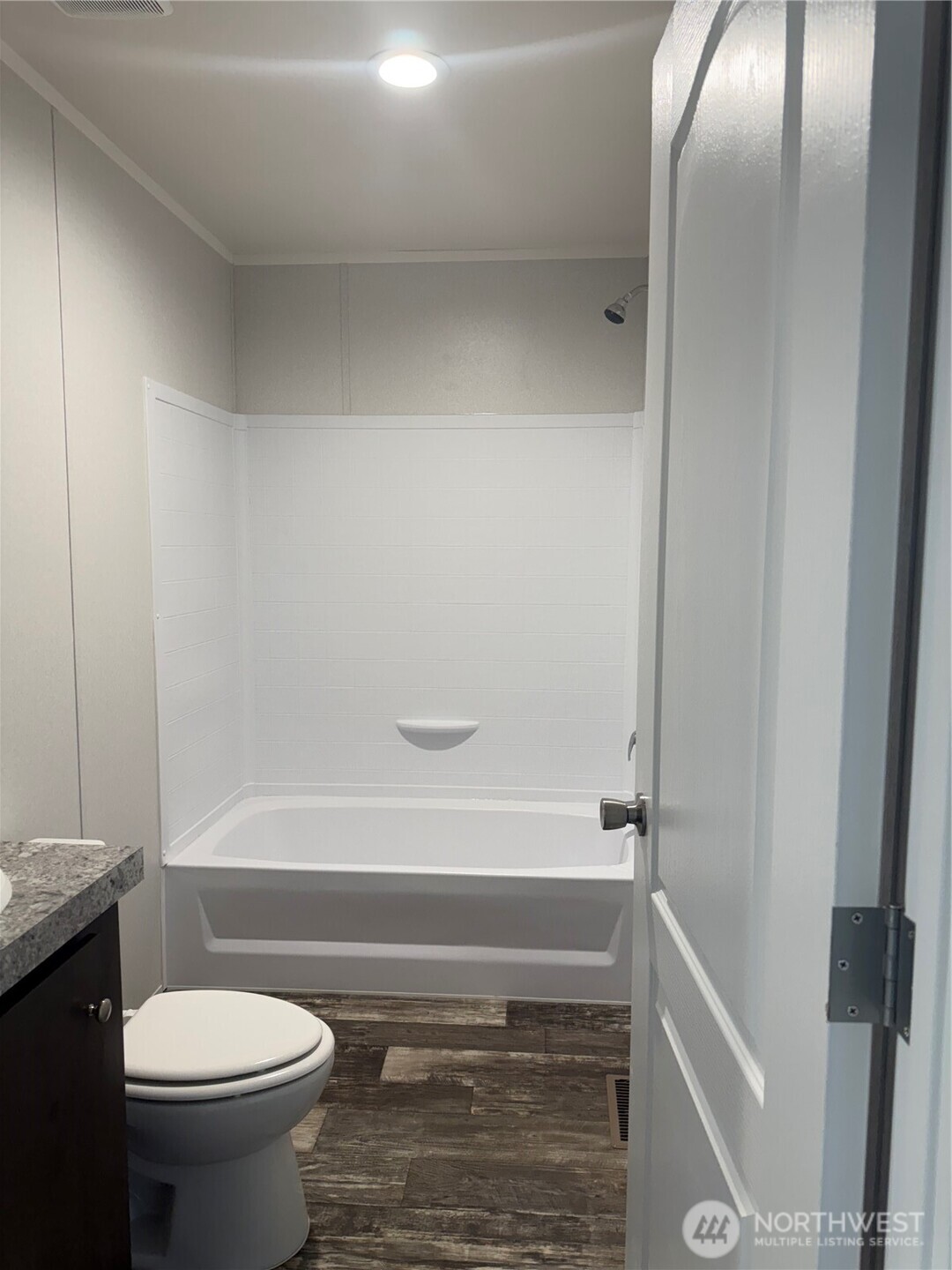 200 West Hawthorn Street, Unit 32 Connell, WA 99326 - Photo 6 of 16 a bathroom with a toilet and a shower