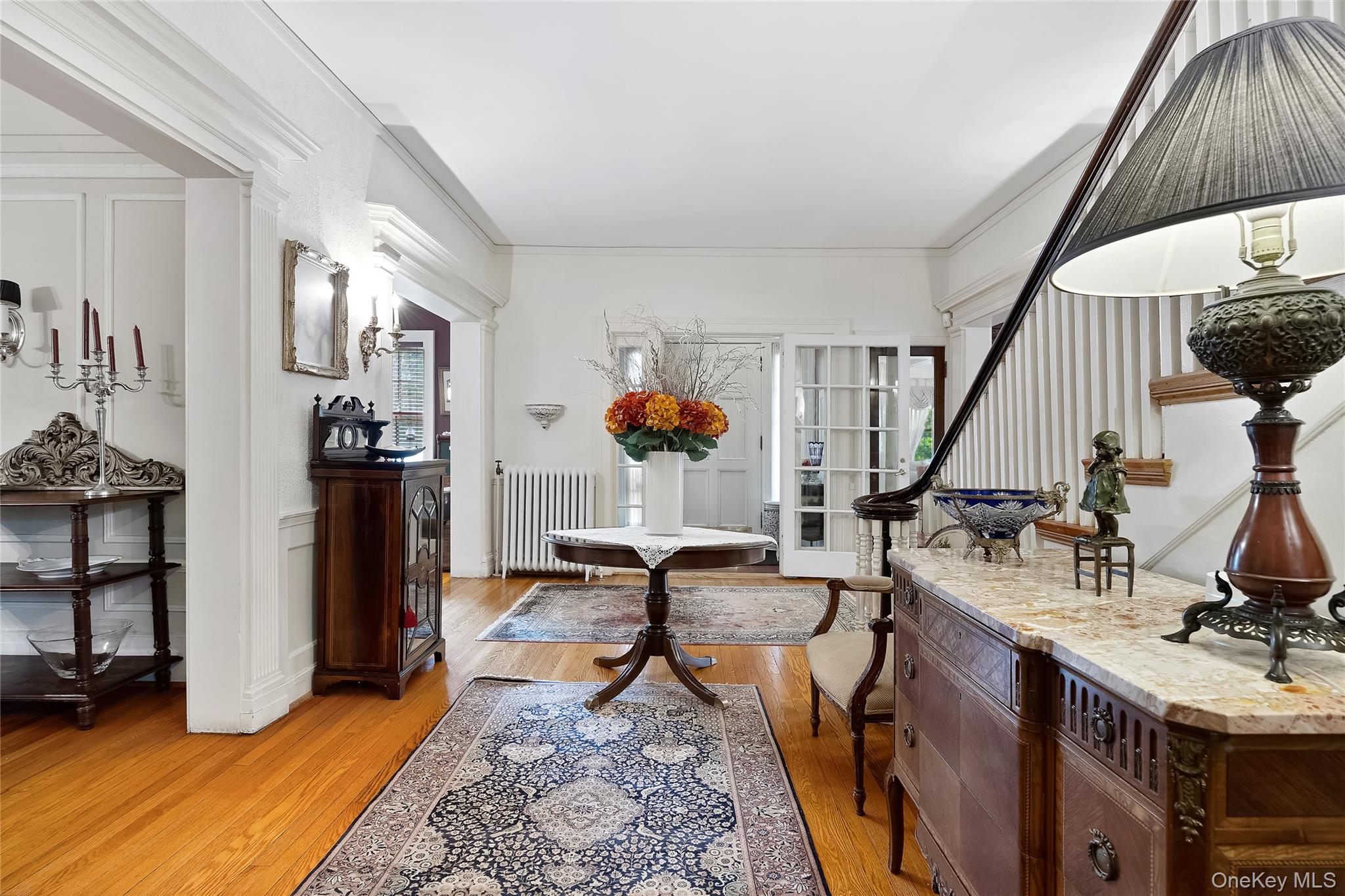 1-27 Beverly Road Queens, NY 11363 - Photo 24 of 46 a living room with furniture and wooden floor