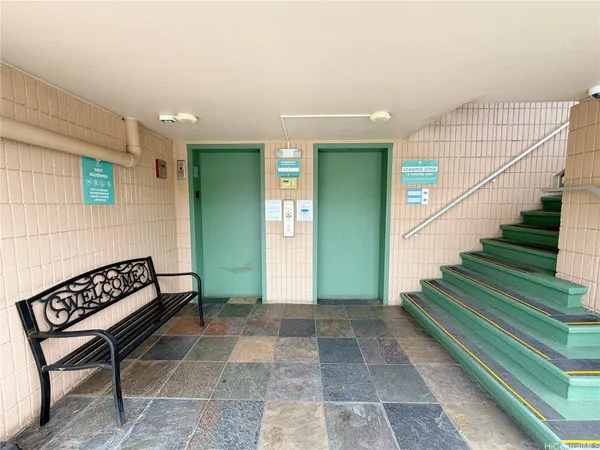 a view of entryway with stairs and a rug