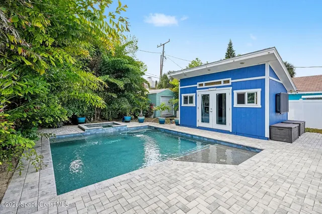 a view of a house with swimming pool