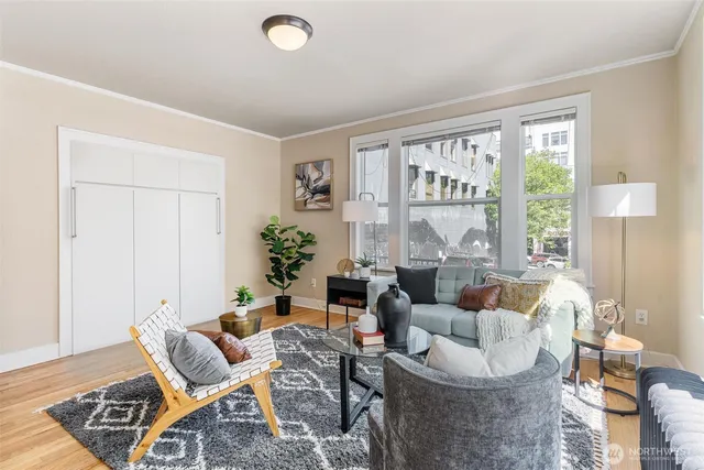 a living room with furniture and a large window