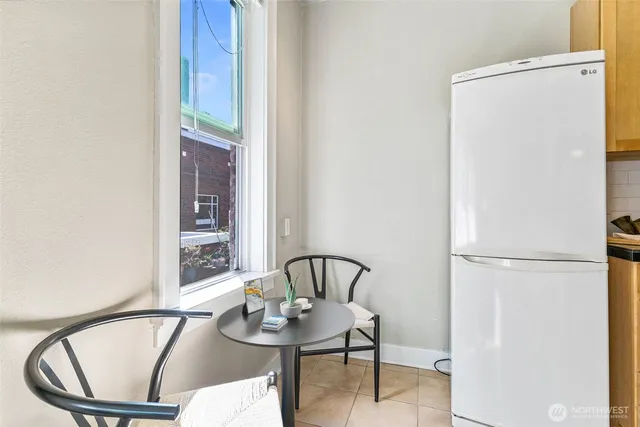 a view of a dining room with furniture and a table