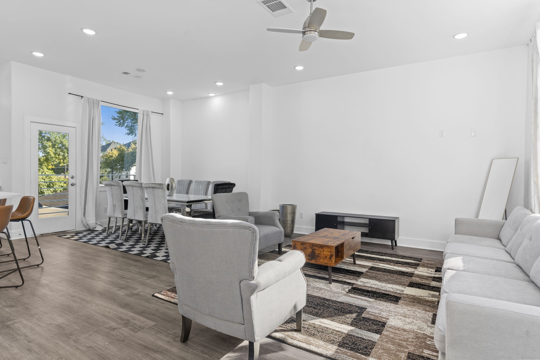 6721 St Augustine Street Houston, TX 77021 - Photo 42 of 45 Modern open floor plan combining dining and living areas with effortless style.