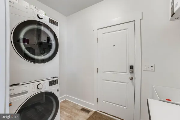 a view of a storage & utility room with washer and dryer