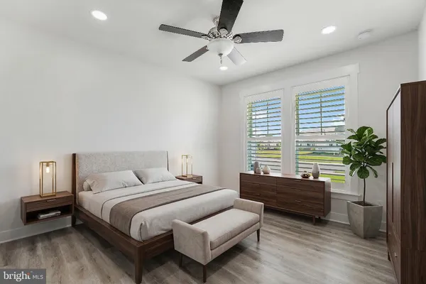 a bedroom with furniture and a window