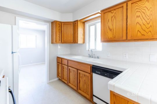 1604 Ewing Circle Ridgecrest, CA 93555 - Photo 6 of 19 a kitchen with stainless steel appliances a sink and a cabinets