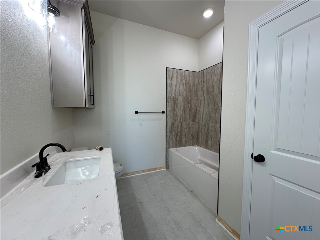 1113 Alice Circle Temple, TX 76502 - Photo 17 of 21 a bathroom with a sink a toilet and shower