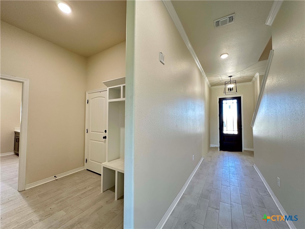 1113 Alice Circle Temple, TX 76502 - Photo 2 of 21 a view of a hallway with wooden floor and closet