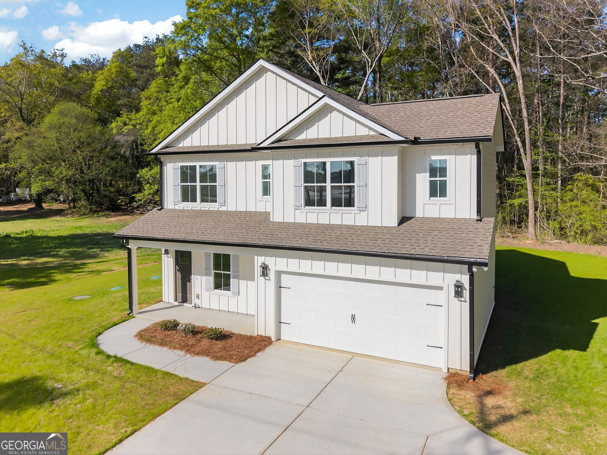 1229 Chappell Mill Road Jackson, GA 30233 - Photo 6 of 55 a front view of a house with garden