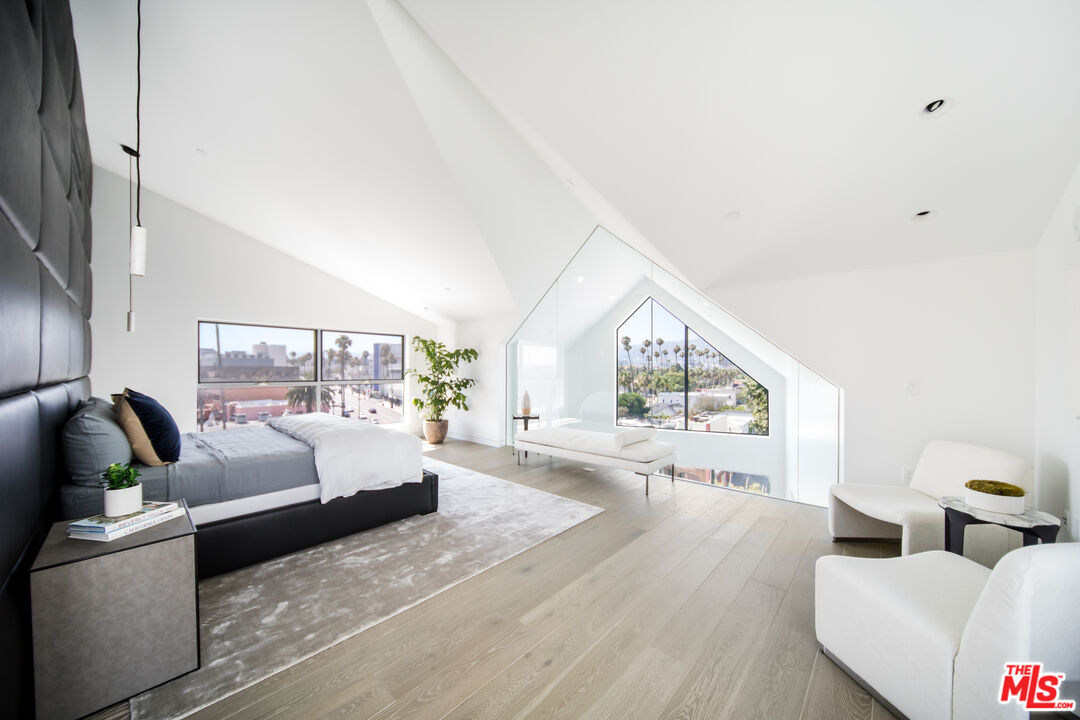 8600 Wilshire Boulevard, Unit PH17 Beverly Hills, CA 90211 - Photo 11 of 32 a living room with furniture and a large window