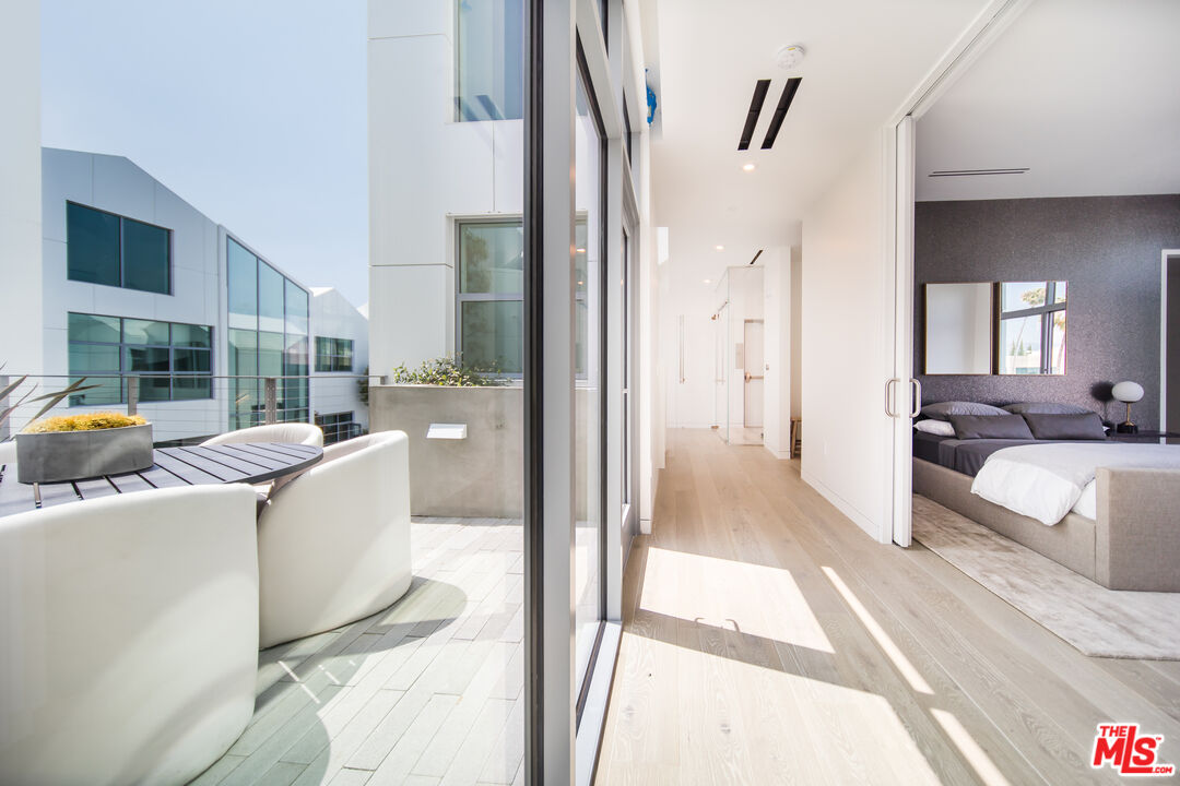8600 Wilshire Boulevard, Unit PH17 Beverly Hills, CA 90211 - Photo 19 of 32 a living room with furniture and a large window