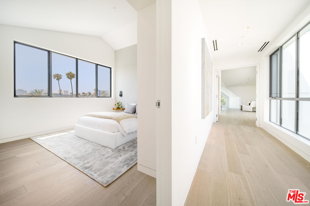 8600 Wilshire Boulevard, Unit PH17 Beverly Hills, CA 90211 - Photo 20 of 32 a living room with furniture and a table