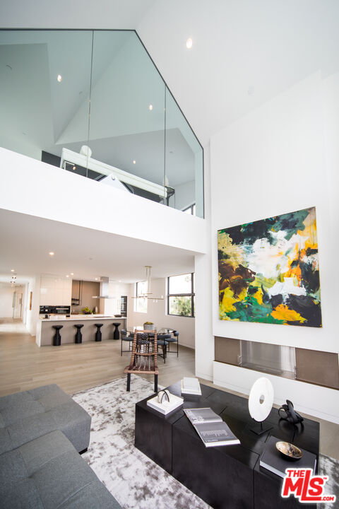 8600 Wilshire Boulevard, Unit PH17 Beverly Hills, CA 90211 - Photo 5 of 32 a living room with furniture and a flat screen tv