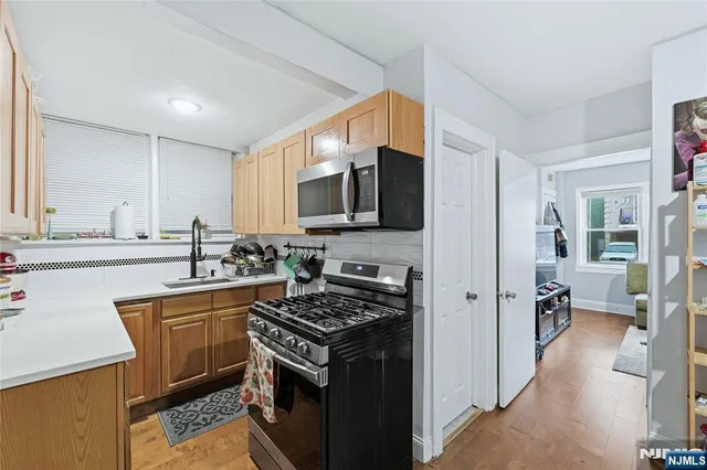 a view of a dining room with furniture and a window