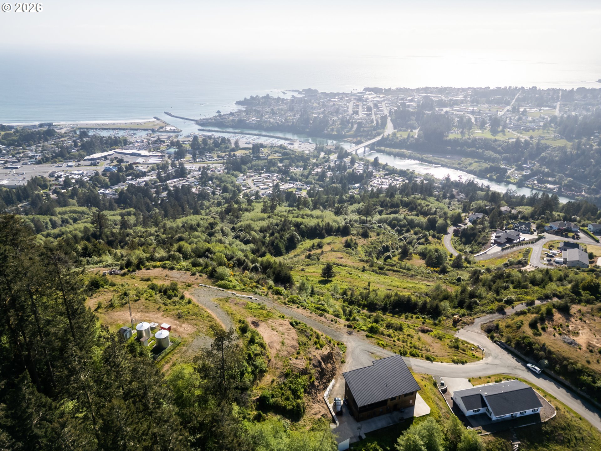 Jodel Court, Unit 2 Brookings, OR 97415 - Photo 2 of 14 an aerial view of residential houses with city view