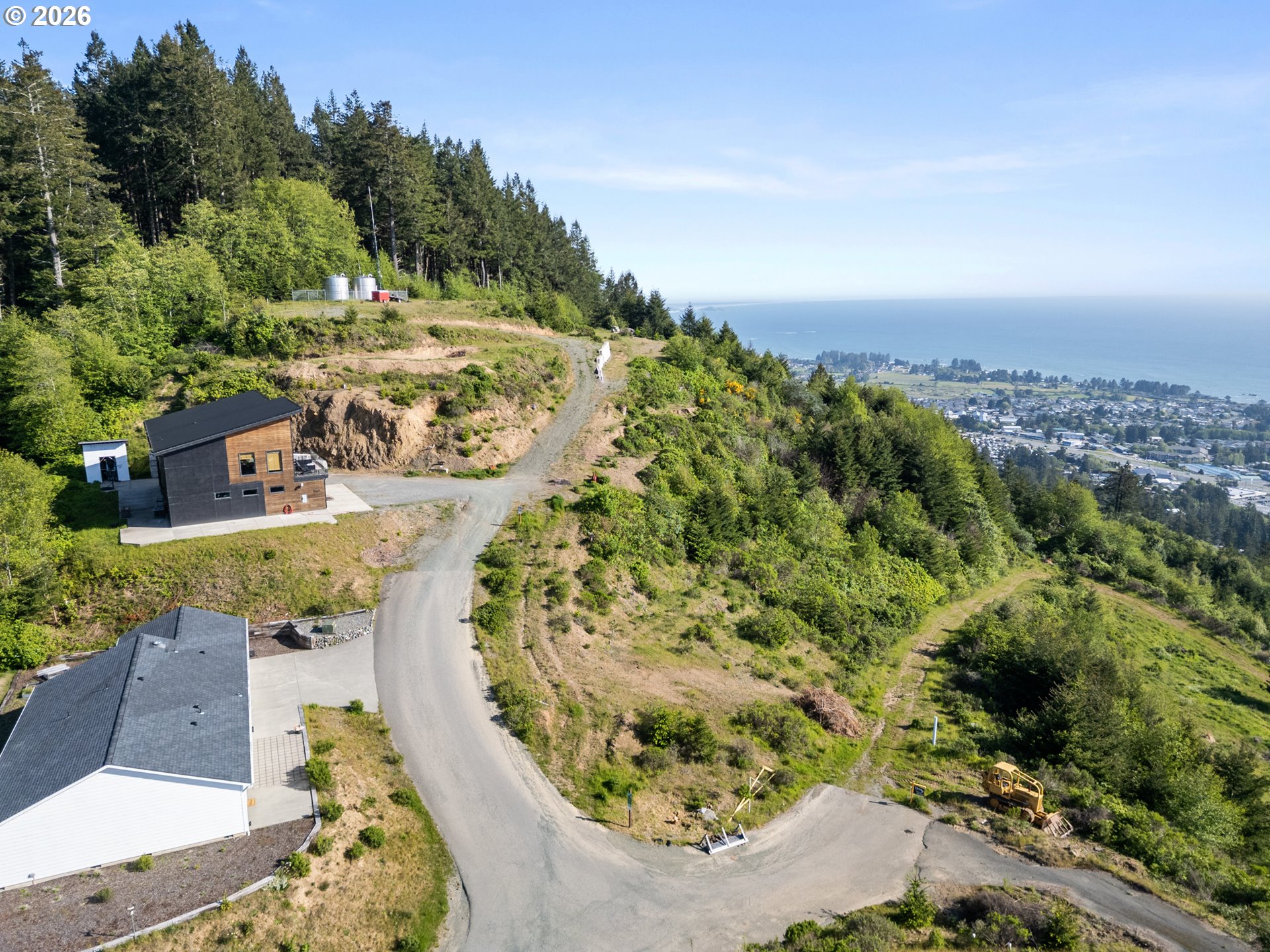Jodel Court, Unit 2 Brookings, OR 97415 - Photo 3 of 14 an aerial view of a house with a yard