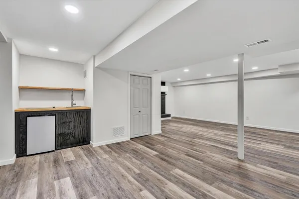 a view of a kitchen with a sink and a large window