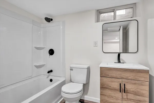 a bathroom with a toilet sink and bathtub