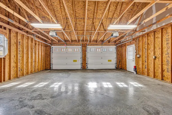 a view of a room with window and a garage
