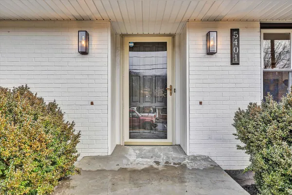 a view of a brick house with an outdoor space
