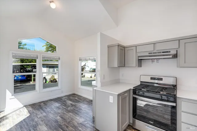 a kitchen with a stove and a refrigerator